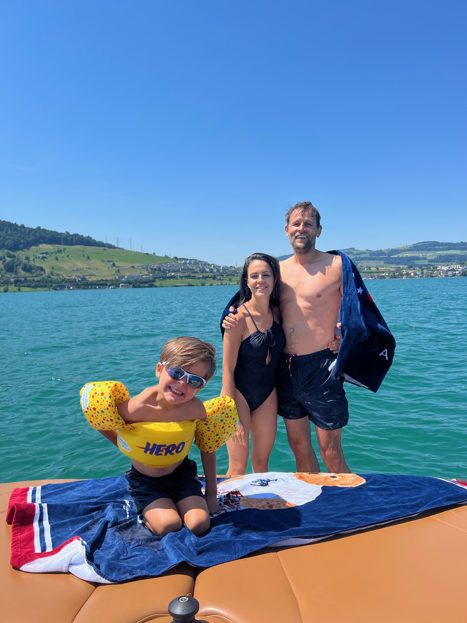Family with kids on a boat on Lake Zug, Switzerland