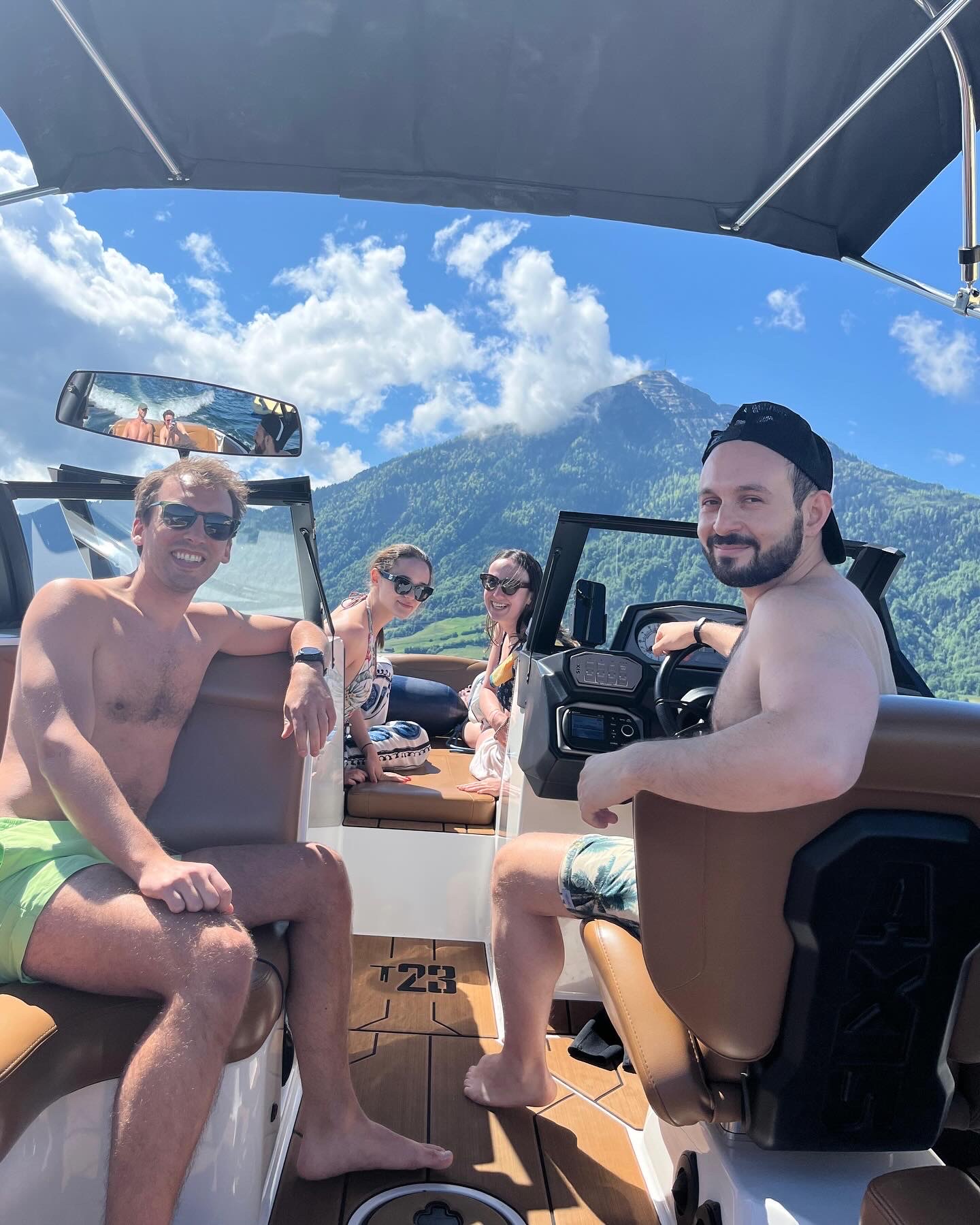 Group on the wakeboat with Mt. Rigi behind on Lake Zug
